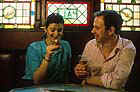 A couple enjoy a whisky in a pub